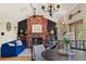 Inviting living room features a brick fireplace, vaulted ceilings, and a comfortable seating area at 1430 S Lima St, Aurora, CO 80012