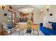 Sunlit living room showcasing hardwood floors and seamless flow to the dining area at 1430 S Lima St, Aurora, CO 80012
