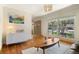 Bright living area with hardwood floors, contemporary decor, and a large window at 1430 S Lima St, Aurora, CO 80012