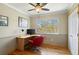 Charming office space features a modern desk, bright window, and hardwood flooring at 1430 S Lima St, Aurora, CO 80012
