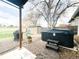 Backyard featuring a hot tub and outdoor storage, perfect for relaxing or storing yard items at 5690 W 79Th Ave, Arvada, CO 80003