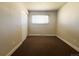 Carpeted bedroom with a window and built-in closet space at 5690 W 79Th Ave, Arvada, CO 80003