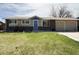 Attractive single-story home with a brick facade, attached garage and well-manicured lawn at 5690 W 79Th Ave, Arvada, CO 80003