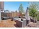 Comfortable deck area with outdoor seating, fireplace, and shade offers a relaxing outdoor space at 2408 Irving St, Denver, CO 80211