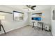 Bedroom with two windows, a ceiling fan, carpet, and two monitors atop a desk at 2408 Irving St, Denver, CO 80211