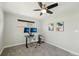 Bedroom with a ceiling fan, carpet, and two monitors atop a desk at 2408 Irving St, Denver, CO 80211