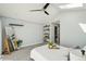 Bedroom featuring vaulted ceilings, and a view into the ensuite bathroom at 2408 Irving St, Denver, CO 80211