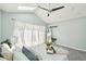 Bedroom featuring vaulted ceilings, skylights, and sheer curtains at 2408 Irving St, Denver, CO 80211