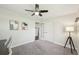 Bedroom with a ceiling fan, carpet, and a lamp at 2408 Irving St, Denver, CO 80211