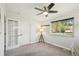 Bright bedroom with a modern ceiling fan, large window, and neutral decor at 2408 Irving St, Denver, CO 80211