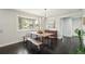 Bright dining area with a live edge table, bay window and hardwood floors at 2408 Irving St, Denver, CO 80211