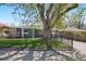 Charming home with well-maintained lawn, a fenced yard, and mature trees, perfect for Gathering living at 2408 Irving St, Denver, CO 80211