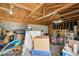 Cluttered garage space offers plenty of storage and parking, ideal for project space at 2408 Irving St, Denver, CO 80211