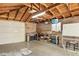 This functional garage includes ample workspace with a television, storage, and natural lighting at 2408 Irving St, Denver, CO 80211