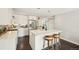 Modern kitchen with white cabinets, an island, and stainless steel appliances at 2408 Irving St, Denver, CO 80211