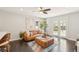 Inviting living room with natural light, a comfortable leather sofa, and elegant decor at 2408 Irving St, Denver, CO 80211