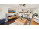 Bright living room with open kitchen, hardwood floors, stylish furnishings, and modern decor at 2408 Irving St, Denver, CO 80211