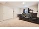 Finished basement offers tiered leather seating with a sliding barn door to a large storage area at 25561 E 5Th Pl, Aurora, CO 80018