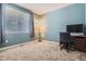 Bedroom with large window, blue walls and desk at 25561 E 5Th Pl, Aurora, CO 80018