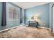 Bright bedroom with large window and blue walls at 25561 E 5Th Pl, Aurora, CO 80018