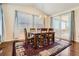 Dining area featuring hardwood floors and access to the outside deck offering a comfortable space at 25561 E 5Th Pl, Aurora, CO 80018