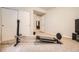 View of a home gym with a Total Gym XL exercise machine and mirrored closet at 25561 E 5Th Pl, Aurora, CO 80018