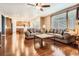 Open living room with hardwood floors, neutral paint and seamlessly connects with the kitchen at 25561 E 5Th Pl, Aurora, CO 80018