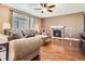 Inviting living room with hardwood floors, fireplace, neutral paint and ample natural light from the window at 25561 E 5Th Pl, Aurora, CO 80018