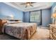 Primary bedroom with tray ceiling, soft lighting, and carpeted floor at 25561 E 5Th Pl, Aurora, CO 80018