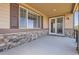 Covered patio featuring a large window view into the home; great for entertaining outdoors at 25561 E 5Th Pl, Aurora, CO 80018