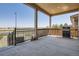This covered back patio has plenty of space to grill and entertain with a view of the outdoors at 25561 E 5Th Pl, Aurora, CO 80018