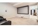 Finished basement theater room boasts a large wall screen for great home movie nights at 25561 E 5Th Pl, Aurora, CO 80018
