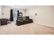 Home theater featuring comfortable seating and a window for natural light at 25561 E 5Th Pl, Aurora, CO 80018