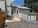 Backyard patio with rock garden, shed, seating and fence at 6887 S Dover Way, Littleton, CO 80128