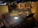 Outdoor patio space with lighting and outdoor furniture, perfect for evening relaxation at 6887 S Dover Way, Littleton, CO 80128