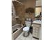 Bathroom featuring tiled shower/bath, toilet and vanity at 6887 S Dover Way, Littleton, CO 80128