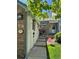 Charming front entrance with brick accents, wind chimes, and a welcoming garden at 6887 S Dover Way, Littleton, CO 80128