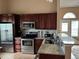 This modern kitchen boasts stainless steel appliances and stone countertops at 6887 S Dover Way, Littleton, CO 80128