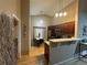 Well-lit kitchen featuring stainless steel appliances and an adjacent dining area at 6887 S Dover Way, Littleton, CO 80128