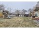 Backyard view of playset, hot tub, and trampoline at 1840 Rowena St, Thornton, CO 80229