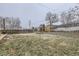 Grass backyard with playset and wood fence at 1840 Rowena St, Thornton, CO 80229