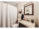 Clean bathroom with updated vanity and shower at 1840 Rowena St, Thornton, CO 80229