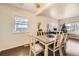 Bright dining room with table, chairs, and hardwood floors at 1840 Rowena St, Thornton, CO 80229