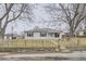 Ranch style home with wood fence and landscaping at 1840 Rowena St, Thornton, CO 80229