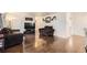 Living room with dark brown couch and hardwood floors at 1840 Rowena St, Thornton, CO 80229