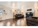 Living room with couch, hardwood floors and TV at 1840 Rowena St, Thornton, CO 80229