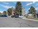 Exterior view of Chestnut Lane building with reserved parking at 4899 S Dudley St # 3A, Littleton, CO 80123