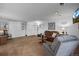 Cozy living area with a built-in murphy bed, plush seating, and soft natural light at 4899 S Dudley St # 3A, Littleton, CO 80123