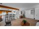 Comfortable living space featuring a breakfast bar, Murphy bed, and open layout at 4899 S Dudley St # 3A, Littleton, CO 80123