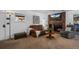 Comfortable living room with a brick fireplace, soft seating, and a mounted flat screen television at 4899 S Dudley St # 3A, Littleton, CO 80123